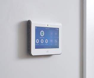 ADT Command Panel An ADT security touchscreen panel mounted on a wall, displaying system status and smart controls for business security.