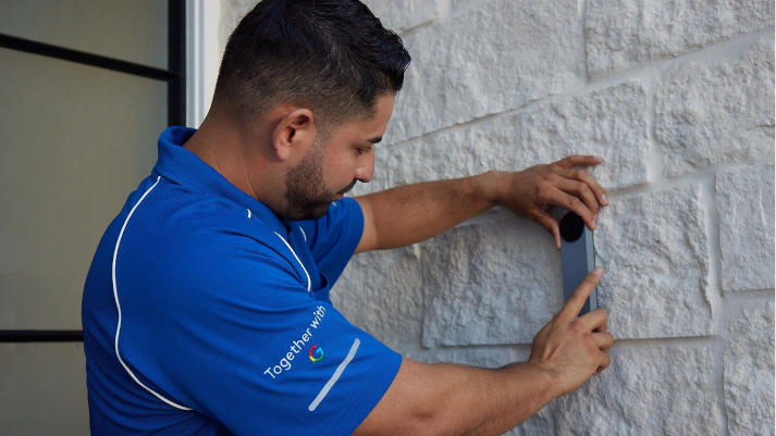 ADT technitian installing indoor camera