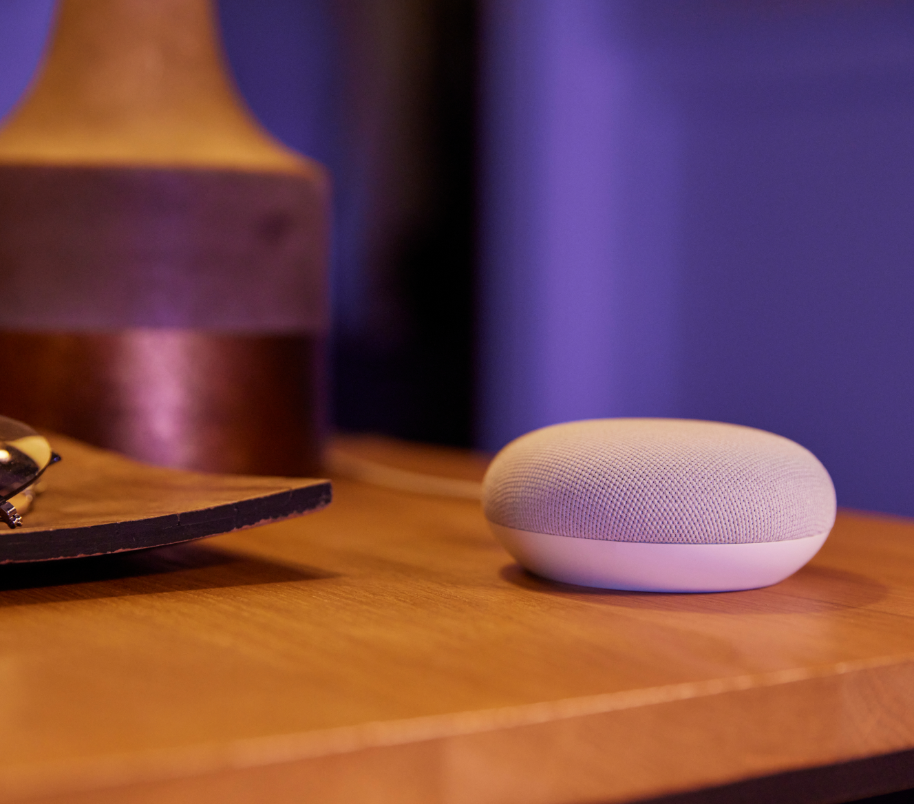 Google Nest Mini 2 Gen on a bedside table